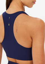 THE UPSIDE women's navy recycled peached Daytona Jetta Racerback Sports Bra is designed for a supportive fit and features removable cups. Made for yoga & pilates.