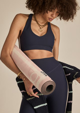 THE UPSIDE women's navy recycled peached Daytona Jetta Racerback Sports Bra is designed for a supportive fit and features removable cups. Made for yoga & pilates.