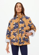 THE UPSIDE women's floral Aruba Quilted Nicola Jacket is designed for an oversized fit and features patch pockets and antique brass zipper. Made for lifestyle.