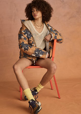 THE UPSIDE women's floral Aruba Quilted Nicola Jacket is designed for an oversized fit and features patch pockets and antique brass zipper. Made for lifestyle.