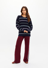 THE UPSIDE women's stripe organic cotton Sebastian Crew Knit Sweater is designed for a relaxed fit and features a knitted rib neckline and cuffs. Made for lifestyle.
