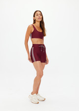 THE UPSIDE women's merlot Oxford 4 Inch Spin Short features an elastic drawcord through waist with mint side seam stripes. Made for yoga & pilates.