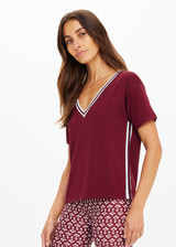 THE UPSIDE women's merlot Sienna V Neck Tee is a retro style slim fit track tee in a lightweight knit and features a deep V neckline. Made for everyday.