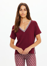 THE UPSIDE women's merlot Sienna V Neck Tee is a retro style slim fit track tee in a lightweight knit and features a deep V neckline. Made for everyday.