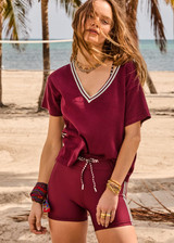 THE UPSIDE women's merlot Sienna V Neck Tee is a retro style slim fit track tee in a lightweight knit and features a deep V neckline. Made for everyday.