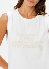 THE UPSIDE women's white organic cotton Stardust Jeet Tank Top is designed for a relaxed fit and features printed star logo on front. Made for lifestyle.