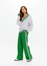 THE UPSIDE women's green Galaxia Loretta Pant is designed for a mid to low rise straight leg fit and features elasticated waistband, drawcord and side seam pockets. Made for lifestyle.