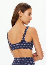 THE UPSIDE women's navy Cruzada Bridie Bra is a soft & supportive fit in a recycled jacquard rib fabrication in mini flag design and features removable cups. Made for yoga & pilates.