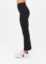 THE UPSIDE women's black Peached Thia Crop Flare is a high-waisted 7/8 length flared pant with a soft folded waistband in recycled peached fabric. Made for yoga & pilates.