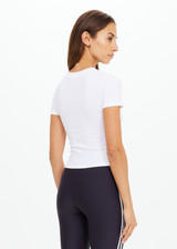 THE UPSIDE women's white Shelter Fitted Tee is made from soft modal rib fabrication and features a embroidered arrow logo at back of neck. Made for everyday wear.