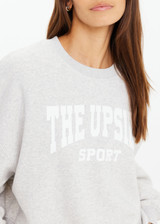 THE UPSIDE women's grey Paloma Crew offers a relaxed fit with drop shoulder and The Upside logo printed on front chest. The perfect everyday jumper.