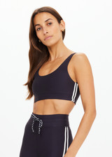 THE UPSIDE women's black Oxford Harley Scoop Bra offers a supportive & comfortable fit made from eco tech performance fabric and features removable cups and contrast white stripes down sides. Made for high impact.