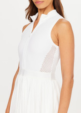 THE UPSIDE women's white Slam Pleated Tennis Dress features a quarter zip opening with mock neck, a pleated light-weight skirt with built-in inner short with pockets. Made for tennis.