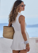 THE UPSIDE women's white Slam Pleated Tennis Dress features a quarter zip opening with mock neck, a pleated light-weight skirt with built-in inner short with pockets. Made for tennis.