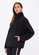 THE UPSIDE women's black Harlow Fleece Pullover offers a relaxed fit made from recycled warm fleece fabric and features zip pockets and an elastic at waist and cuffs to keep warmth in. Made for lifestyle.