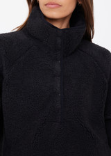 THE UPSIDE women's black Harlow Fleece Pullover offers a relaxed fit made from recycled warm fleece fabric and features zip pockets and an elastic at waist and cuffs to keep warmth in. Made for lifestyle.