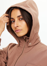 THE UPSIDE women's brown Freddie Fleece Lined Anorak is made from bonded water resistant fabric with internal warm polar fleece and features external pockets with flap closure and drawcord with toggles to cinch in waist.