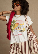 THE UPSIDE women's organic cotton creme Feeling Lucky Jodhi Tee features a classic shape and Feeling Lucky graphic printed on the front chest. Made for everyday wear.