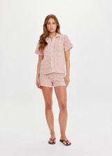 THE UPSIDE women's pink organic cotton Anoki Malik Crochet Short features an elastic waist with tassel braided drawcord and cream scalloped edge detailing. Perfect for travel or everyday.