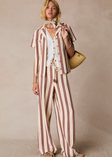THE UPSIDE women's stripe organic cotton Baja Charli Drawstring Pant is low-rise with a straight leg, soft elastic waistband, and wooden bead ends on drawcord. Made for lifestyle.