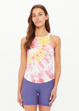 THE UPSIDE women's tie-dye organic cotton Asher Racerback Tank Top features hand tie-dyed tropical shades of pink, red, and yellow on a white base. Made for lifestyle.