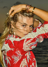 THE UPSIDE women's red Palma Bobbi Collared Shirt features sleeve plackets, pearlised buttons, and cream crochet lace panels. Perfect for travel or lifestyle.