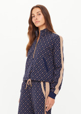 THE UPSIDE women's monogram jacquard Ezra Morgan Quarter Zip features elasticated cuffs, drawcord hem, and front pockets. Made for lifestyle.