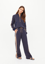 THE UPSIDE women's jacquard Ezra Nova Flare Pant features a monogram geometric design and an elasticated waistband with drawcord. Made for lifestyle.