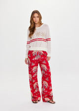 THE UPSIDE women's creme organic cotton Palma Joni Knit Crew features raglan sleeves, palm tree chest design, and red stripes around back and sleeves. Made for lifestyle.