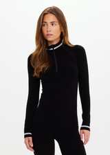 THE UPSIDE women’s black merino Wool Seamless Base Quarter Zip offers a soft & comfortable fit and features white striped ribbing on cuffs and collar. Designed for Après-ski and winter wear.