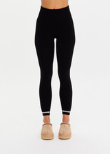 THE UPSIDE women’s black merino Wool Seamless 25inch Legging offers a soft & comfortable fit and features white striped ribbing on cuffs. Designed for Après-ski and winter wear.