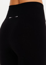 THE UPSIDE women’s black merino Wool Seamless 25inch Legging offers a soft & comfortable fit and features white striped ribbing on cuffs. Designed for Après-ski and winter wear.