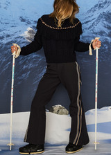 THE UPSIDE women’s navy Clara Tassle Knit Sweater is a relaxed, cable knit design featuring knotted tassels on front and back. Designed for Après-ski and winter wear.