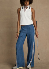 THE UPSIDE women’s blue Lykke Juliet Pant in soft chambray features a low-rise fit, split hem, and contrasting mesh knit side stripe. The perfect travel pant. THE UPSIDE women’s blue Lykke Juliet Pant in soft chambray features a low-rise fit, split hem, and contrasting mesh knit side stripe. The perfect travel pant.