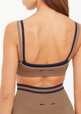 THE UPSIDE women’s recycled Form Seamless Kelsey Bra is a double-layer mocha bra with navy contrast and moisture control. Made for yoga and pilates. THE UPSIDE women’s recycled Form Seamless Kelsey Bra is a double-layer mocha bra with navy contrast and moisture control. Made for yoga and pilates.