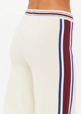 THE UPSIDE women’s creme Adesa Kansas Knit Pant is a wide-leg style featuring short hem splits and a soft elastic waistband. Made for lifestyle.