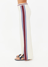 THE UPSIDE women’s creme Adesa Kansas Knit Pant is a wide-leg style featuring short hem splits and a soft elastic waistband. Made for lifestyle.