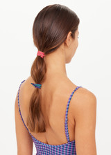 THE UPSIDE 4-Pack Hair Ties features soft elastics in tones of green, purple, silver, sand, burgundy, yellow, pink, and orange. Perfect for daily wear.