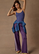 THE UPSIDE women's purple recycled Roma Pant is high-waisted with a drawcord, coated metal aglets, and side seam pockets. Perfect for travel or lifestyle.