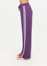 THE UPSIDE women's purple recycled Roma Pant is high-waisted with a drawcord, coated metal aglets, and side seam pockets. Perfect for travel or lifestyle.
