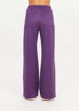 THE UPSIDE women's purple recycled Roma Pant is high-waisted with a drawcord, coated metal aglets, and side seam pockets. Perfect for travel or lifestyle.