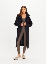 THE UPSIDE women's black James Hooded Trench Coat is a waterproof long line coat and features a fold-a-way hood, magnetic snap closures, an adjustable waist belt and external pockets. The perfect everyday coat.