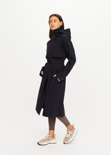 THE UPSIDE women's black James Hooded Trench Coat is a waterproof long line coat and features a fold-a-way hood, magnetic snap closures, an adjustable waist belt and external pockets. The perfect everyday coat.