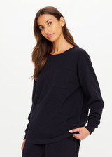 THE UPSIDE women's black recycled cotton Soho Cara Long Sleeve Top is designed for a relaxed fit and features a ribbed neck and cuffs and a patch pocket at front. Made for everyday leisure.