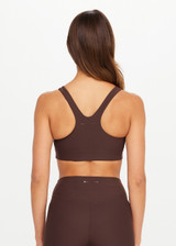 THE UPSIDE women's brown Peached Jade Racerback Bra offers a soft & supportive fit and features removable cups and moisture control properties. Made for yoga & pilates.