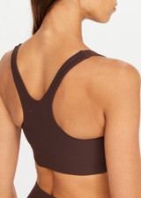 THE UPSIDE women's brown Peached Jade Racerback Bra offers a soft & supportive fit and features removable cups and moisture control properties. Made for yoga & pilates.