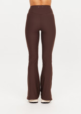 THE UPSIDE women's brown Peached Florence Flare is a high-rise full length flare pant with V waistband and a printed arrow logo on back waistband.