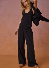 THE UPSIDE women's black recycled cotton Soho Tokio Wide Leg Pant is designed for a relaxed fit and features a soft encased elasticated waistband and wide leg. Made for lifestyle.