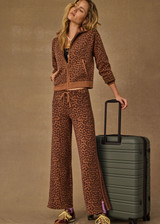 THE UPSIDE women's leopard organic cotton Malawi Freya Knit Pant is true-to-size and features a elasticated waistband with drawcord and short splits at hem. Made for everyday.