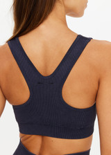 THE UPSIDE women's black Seamless Jade Racerback Bra offers a soft & comfortable fit and features removable cups in a rib fabrication. Made for yoga & pilates.